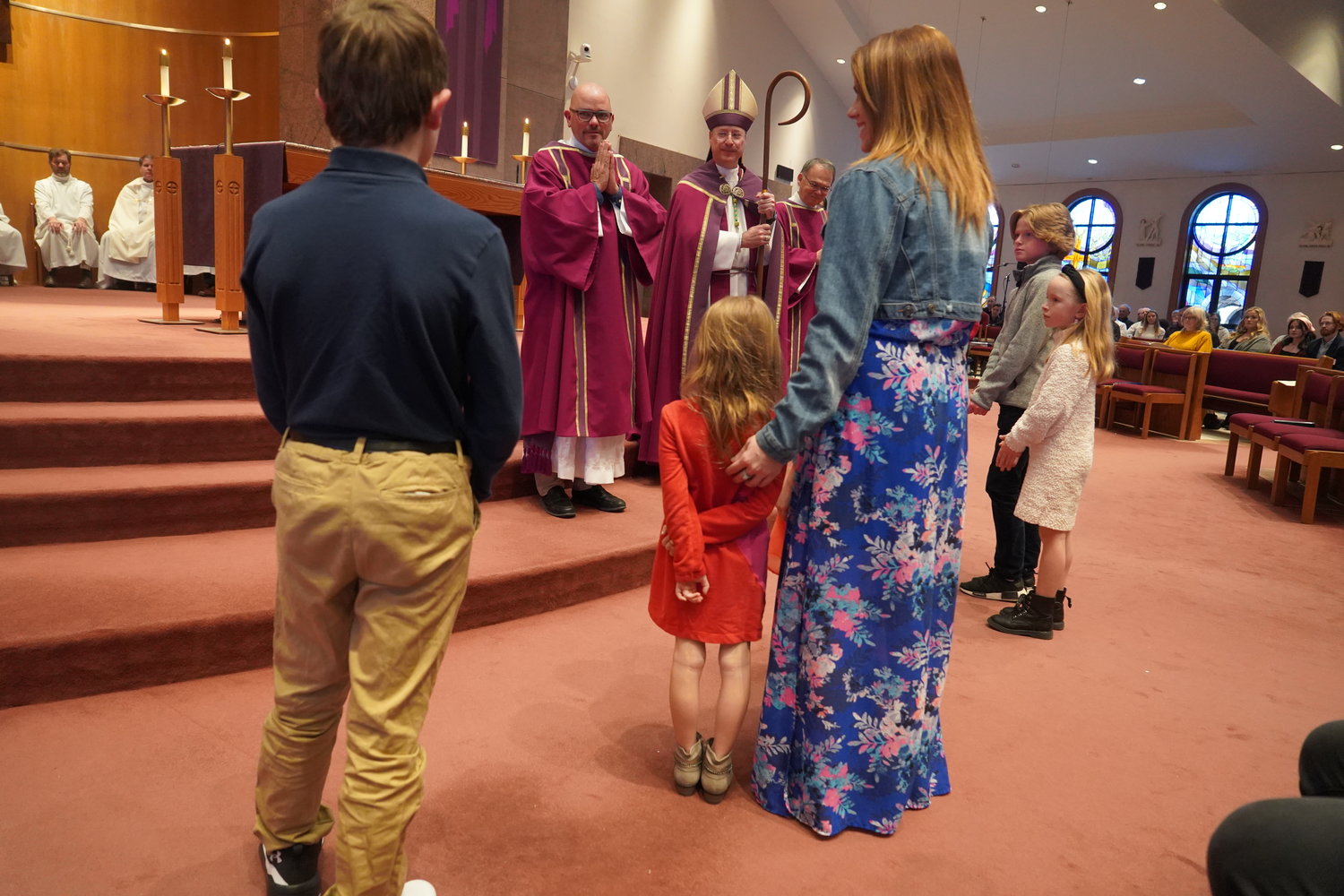 Bishop McKnight greets people who are preparing to receives Sacraments at Easter.